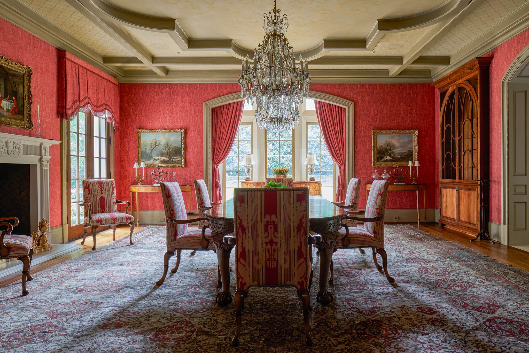 Bold crimson upholstered walls by Fortuny sets the tone for an elegant evening of entertaining. - If you have additional questions regarding 120 Carnarvon Drive  in Houston or would like to tour the property with us call 800-660-1022 and reference MLS# 68693930.