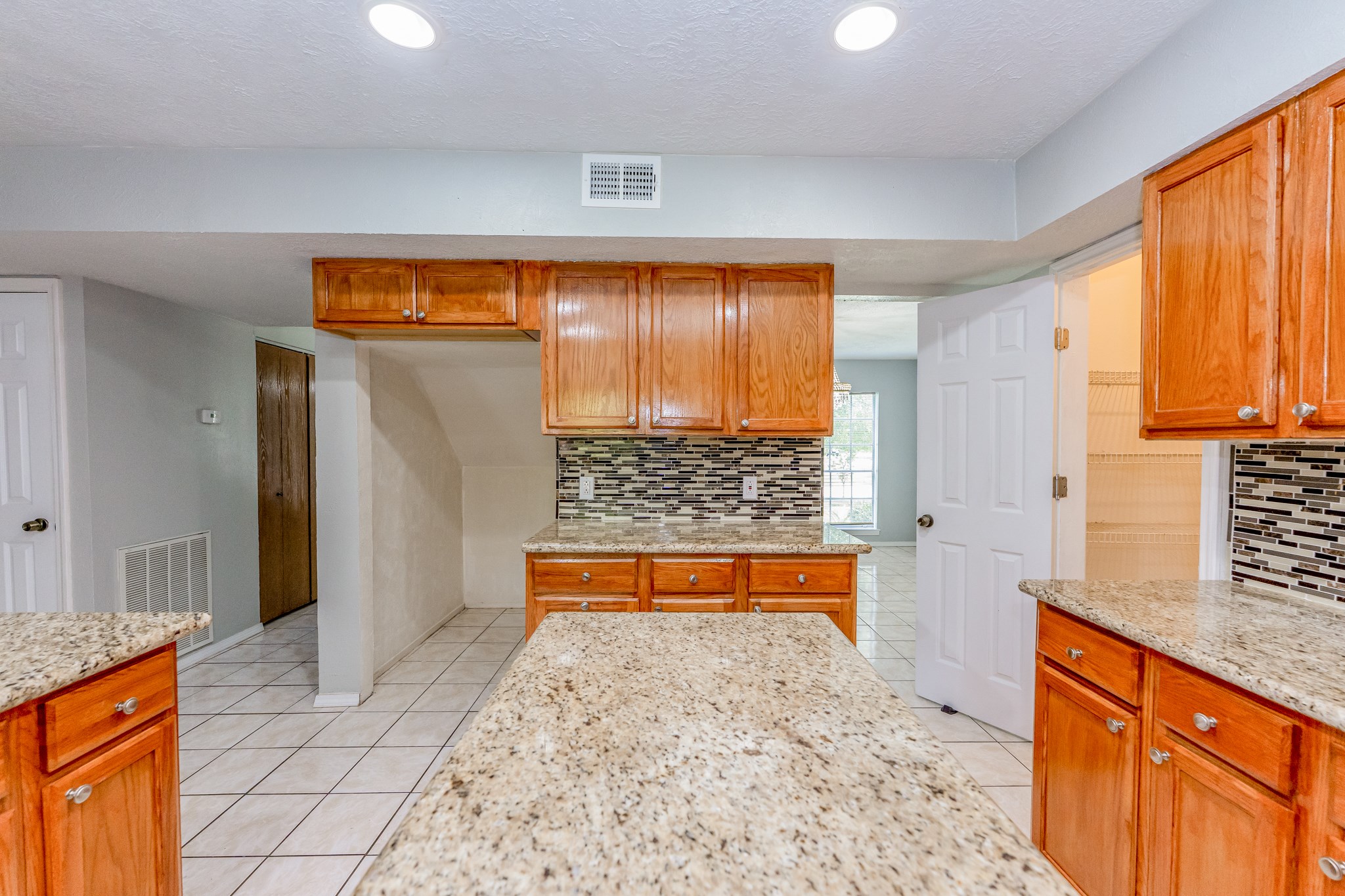 This open concept kitchen is wonderful with granite counters - If you have additional questions regarding 459 Woodrail Drive  in Houston or would like to tour the property with us call 800-660-1022 and reference MLS# 22334908.