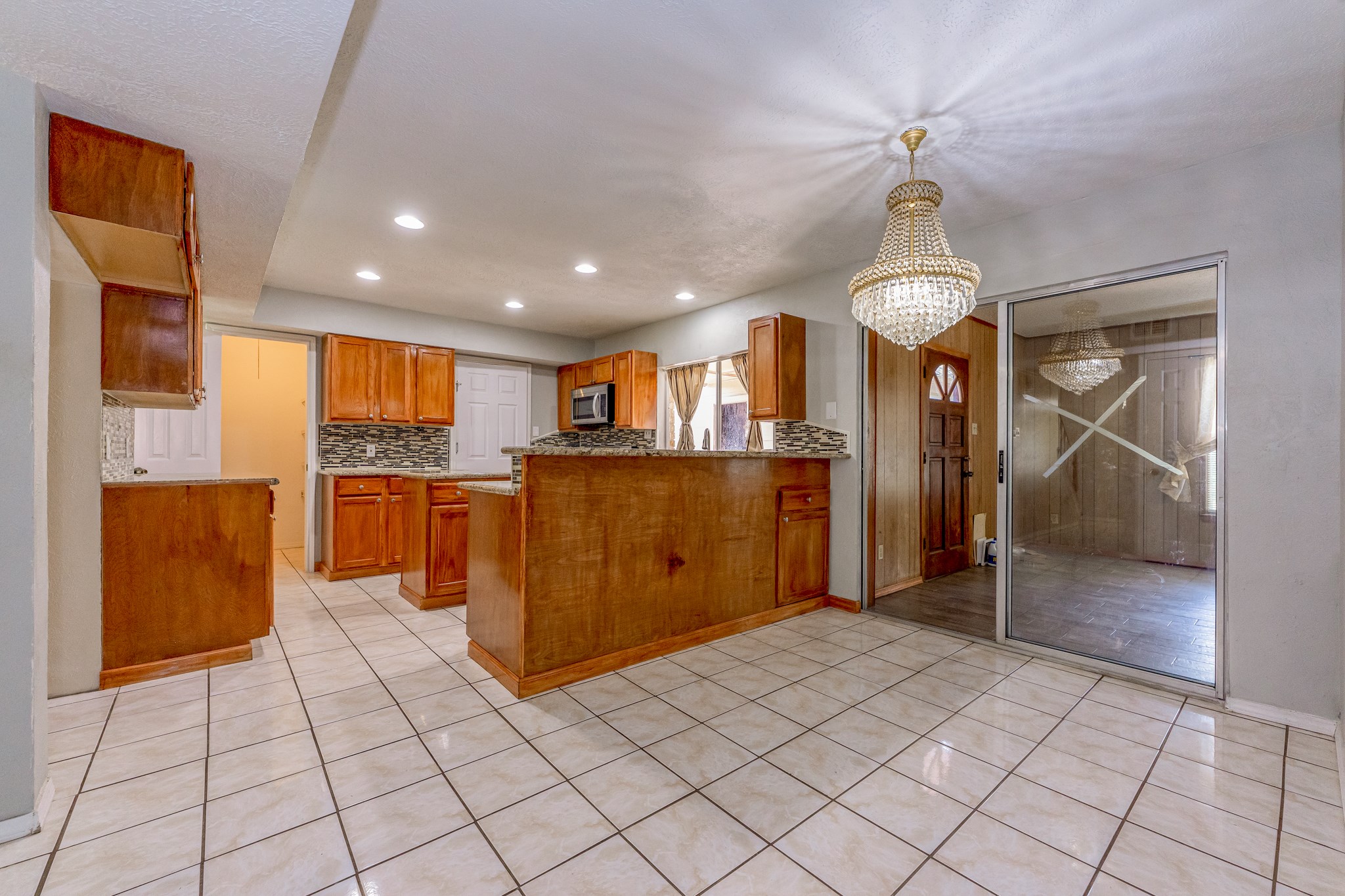 breakfast nook with beautiful chandelier - If you have additional questions regarding 459 Woodrail Drive  in Houston or would like to tour the property with us call 800-660-1022 and reference MLS# 22334908.