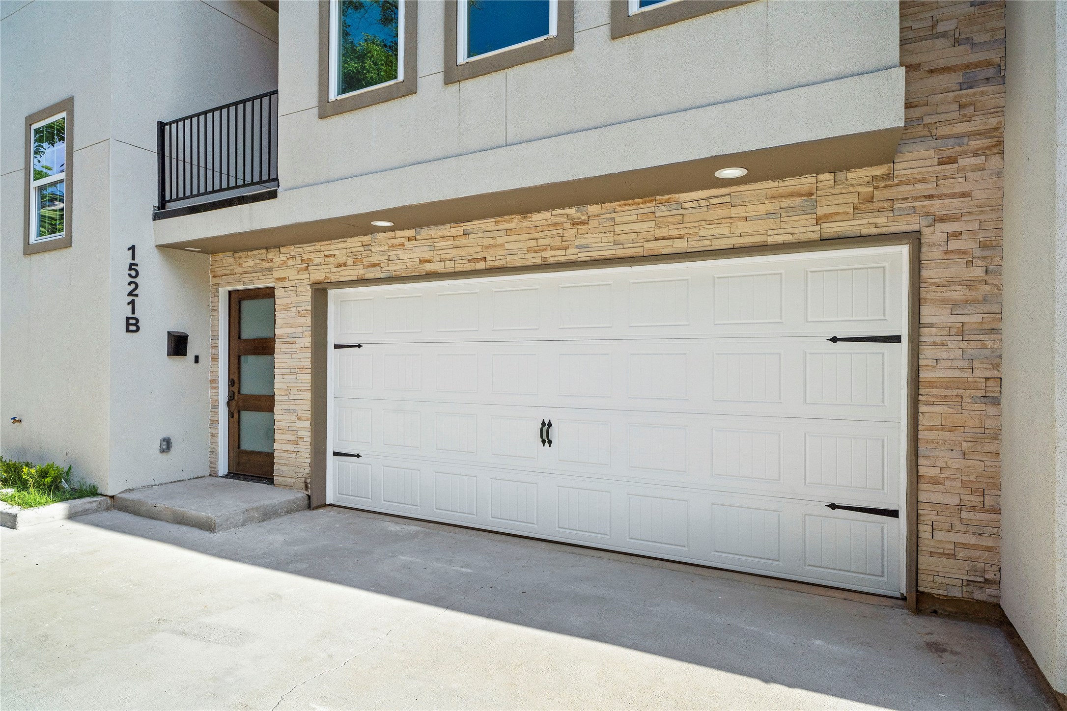 Wide concrete leads to the 2-car garage of your stunning new home! The garage holds ample space and storage and also features an auto garage door opener. - If you have additional questions regarding 1521 Laird Street  in Houston or would like to tour the property with us call 800-660-1022 and reference MLS# 20251638.