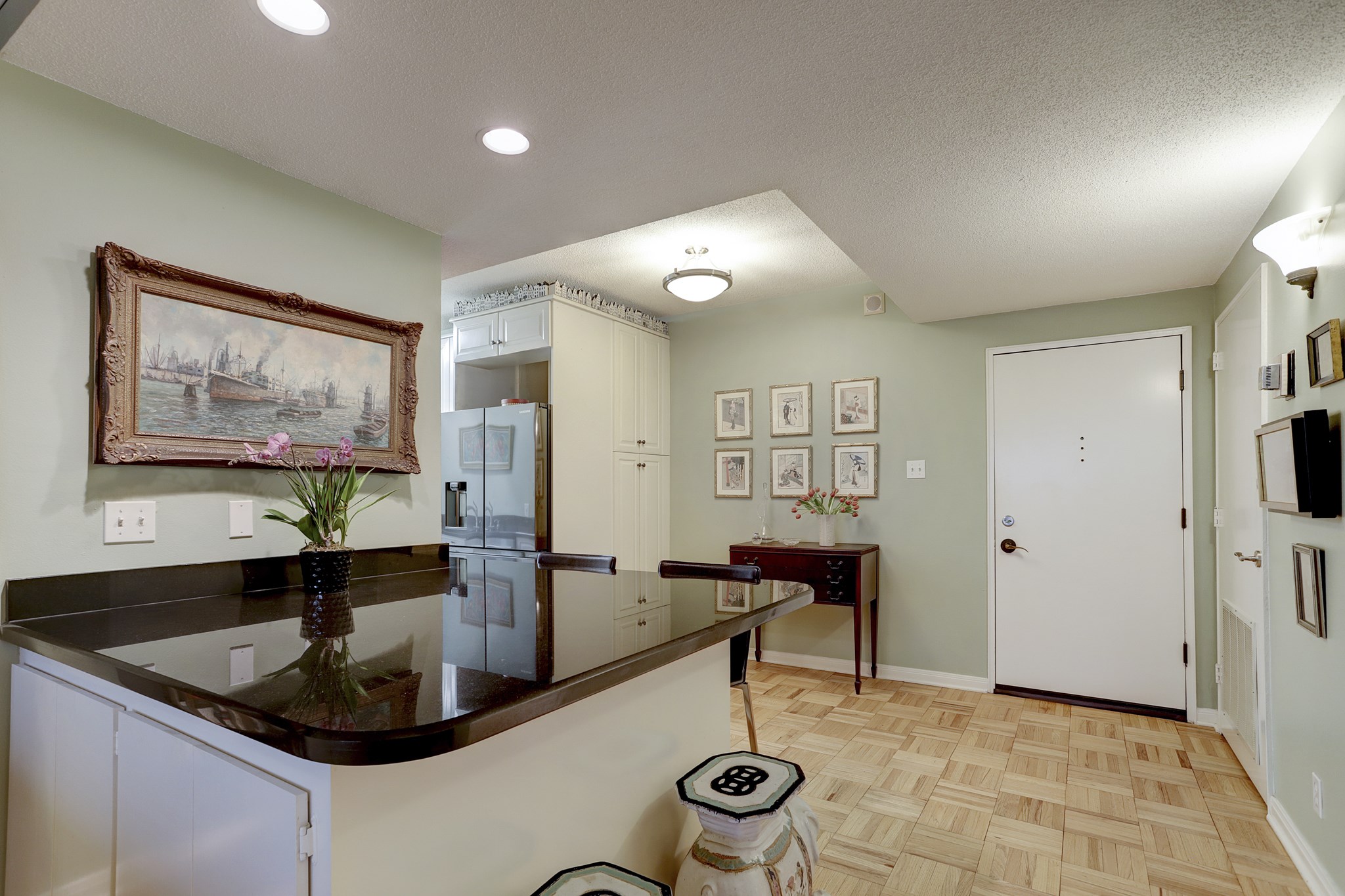 The front door, dining and expansive bar as viewed standing in the living room entrance - If you have additional questions regarding 1400 Hermann Drive  in Houston or would like to tour the property with us call 800-660-1022 and reference MLS# 12717209.