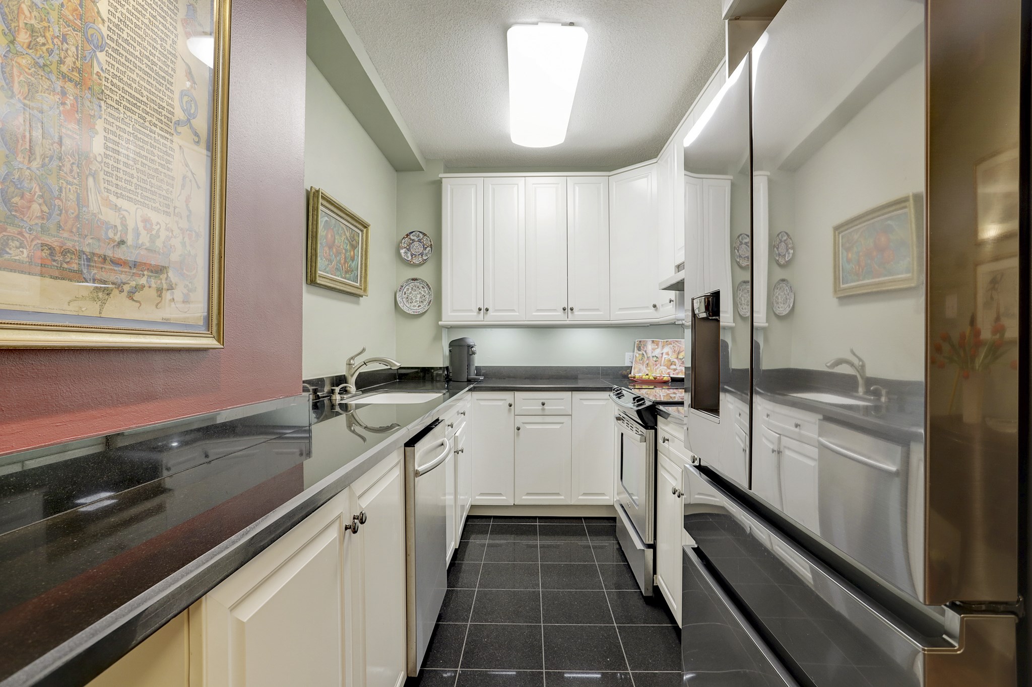 Kitchen is extended and laid out in a galley style with a serving buffet connected to the main bar with undercabinet lighting - If you have additional questions regarding 1400 Hermann Drive  in Houston or would like to tour the property with us call 800-660-1022 and reference MLS# 12717209.