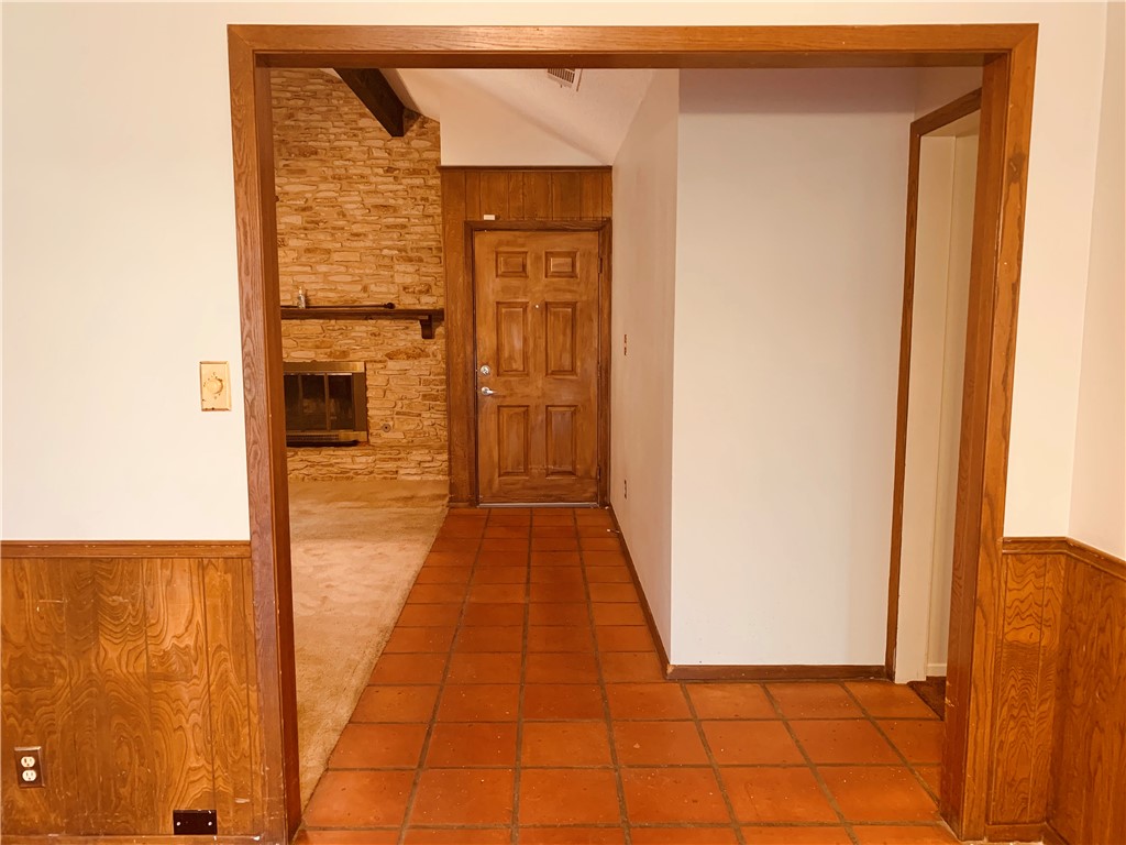 Saltillo tile work from the entry way to the Dining Room. - If you have additional questions regarding 7302 Glenhill Road  in Austin or would like to tour the property with us call 800-660-1022 and reference MLS# 3923725.