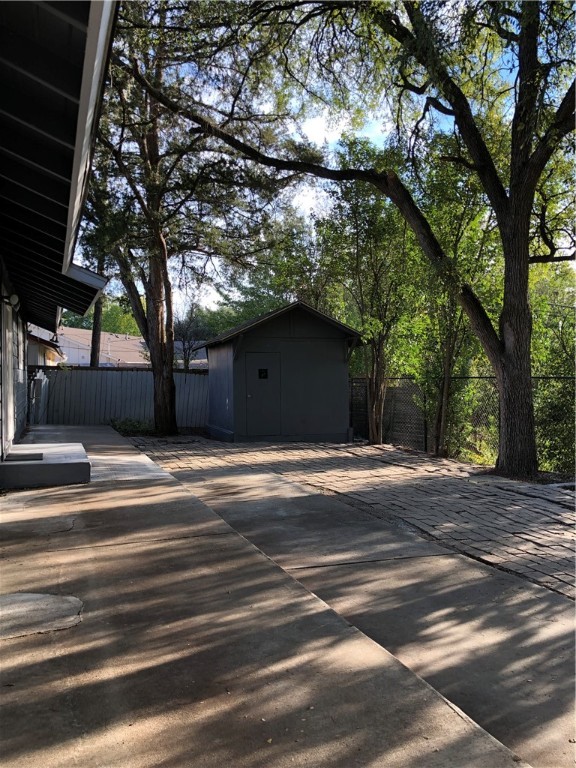 View of Little Walnut Creek and a bit of the sand and pebble beach from backyard - If you have additional questions regarding 6902 Geneva Drive  in Austin or would like to tour the property with us call 800-660-1022 and reference MLS# 5328844.