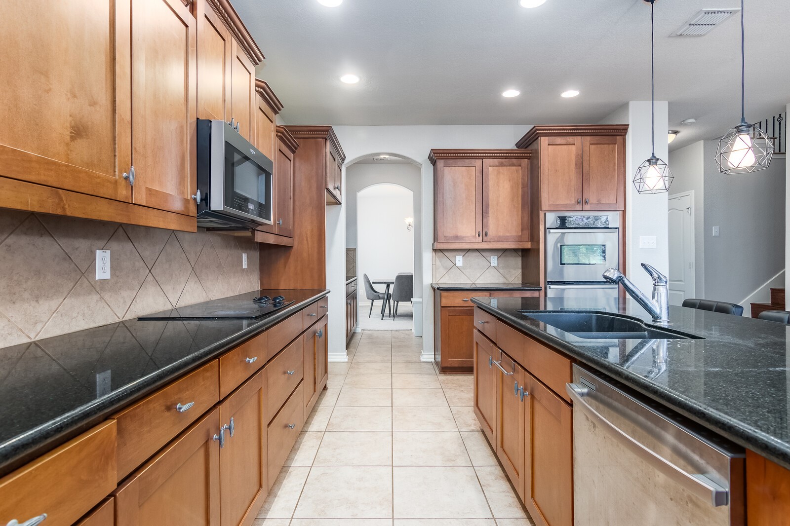 Granite countertops with cabinet spaces. - If you have additional questions regarding 23510 Woodlawn Ridge  in San Antonio or would like to tour the property with us call 800-660-1022 and reference MLS# 19662027.
