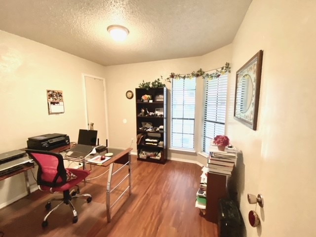 FRONT BEDROOM OR OFFICE - If you have additional questions regarding 11703 Hidden Quail Drive  in Austin or would like to tour the property with us call 800-660-1022 and reference MLS# 8681709.