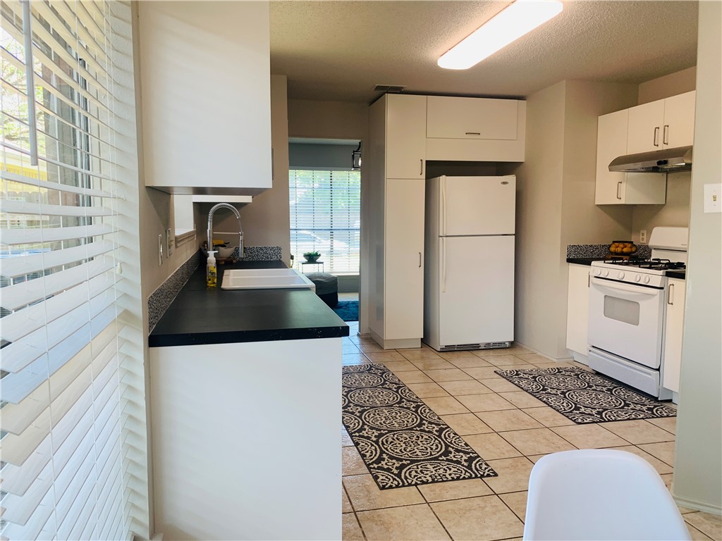 Ikea kitchen updated 2019 - Farmhouse sink, new cabinets, countertops, faucet and backsplash - If you have additional questions regarding 4512 Sojourner Street  in Austin or would like to tour the property with us call 800-660-1022 and reference MLS# 8935600.