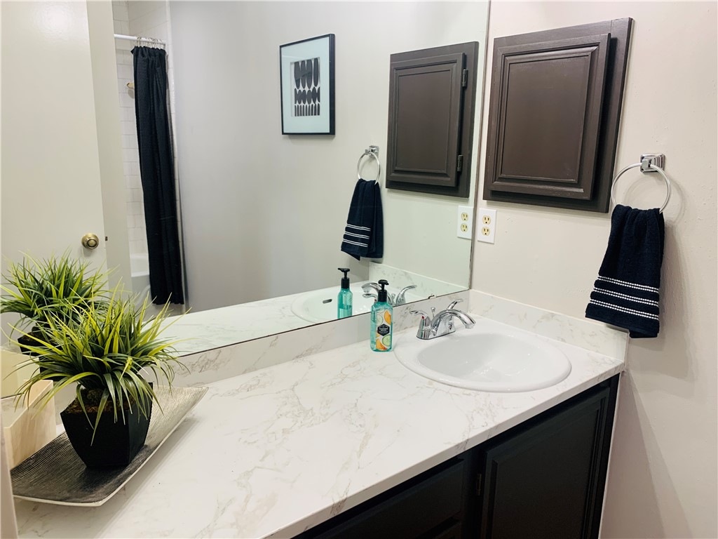 2nd bathroom with updated countertop, sink, fixtures & toilet - If you have additional questions regarding 4512 Sojourner Street  in Austin or would like to tour the property with us call 800-660-1022 and reference MLS# 8935600.