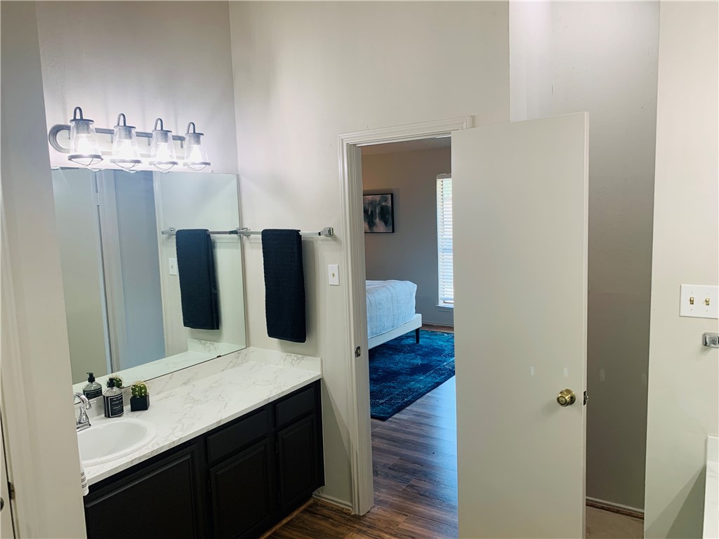 Master bath with separate vanities - upgraded countertops, sinks, faucets, lighting, and toilets. - If you have additional questions regarding 4512 Sojourner Street  in Austin or would like to tour the property with us call 800-660-1022 and reference MLS# 8935600.