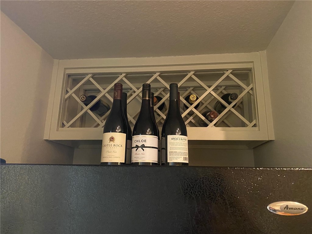Built-in wine rack above the refrigerator - If you have additional questions regarding 1000 Liberty Park Drive  in Austin or would like to tour the property with us call 800-660-1022 and reference MLS# 2545624.