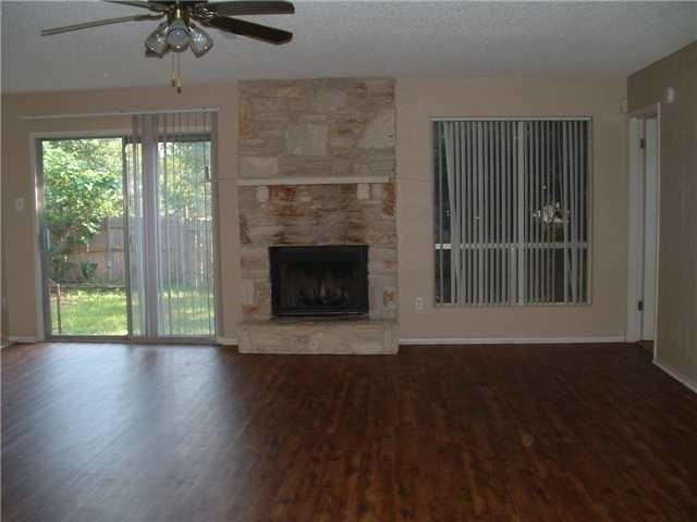 Living Room with fireplace - If you have additional questions regarding 5601 Porsche Lane  in Austin or would like to tour the property with us call 800-660-1022 and reference MLS# 1105926.