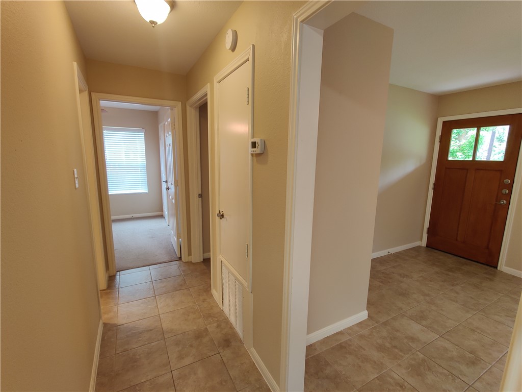 Connecting Hallway from Living Room to kitchen, bathroom and bedrooms - If you have additional questions regarding 300 Wilmes Drive  in Austin or would like to tour the property with us call 800-660-1022 and reference MLS# 3683142.