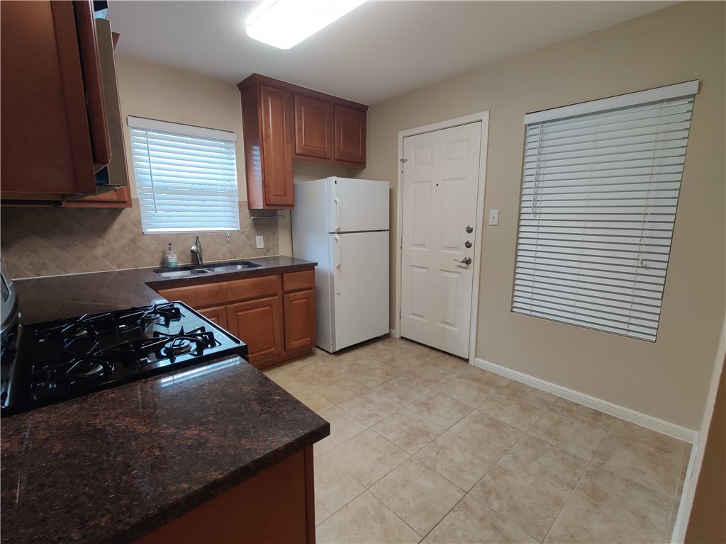Gas Stove, Eating area, and access to the carport. - If you have additional questions regarding 300 Wilmes Drive  in Austin or would like to tour the property with us call 800-660-1022 and reference MLS# 3683142.