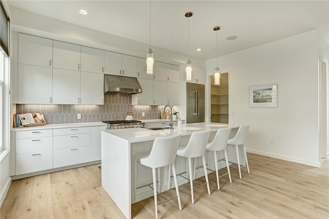 Bright, open kitchen with professional grade appliances. - If you have additional questions regarding 1410 Woodlawn Boulevard  in Austin or would like to tour the property with us call 800-660-1022 and reference MLS# 4947735.