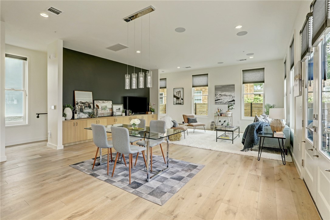 Open floor plan - living and dining - If you have additional questions regarding 1410 Woodlawn Boulevard  in Austin or would like to tour the property with us call 800-660-1022 and reference MLS# 4947735.