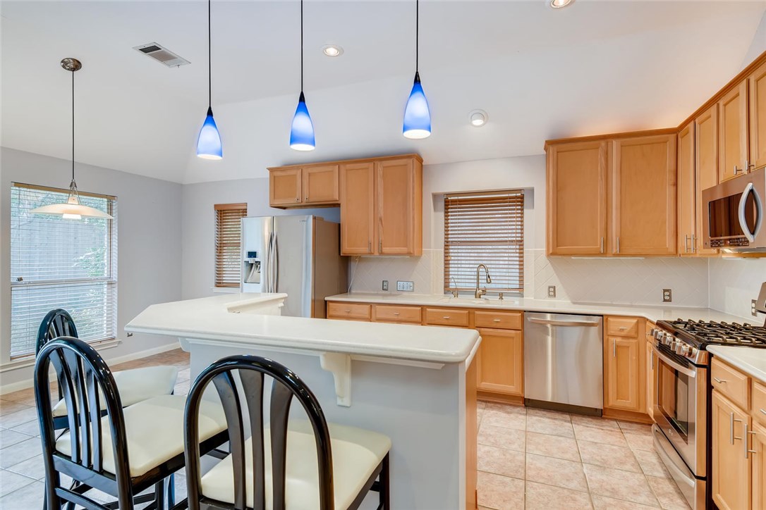Corian counter tops, abundant cabinetry & a cozy breakfast nook. - If you have additional questions regarding 9009 Lantana Way  in Austin or would like to tour the property with us call 800-660-1022 and reference MLS# 6335387.