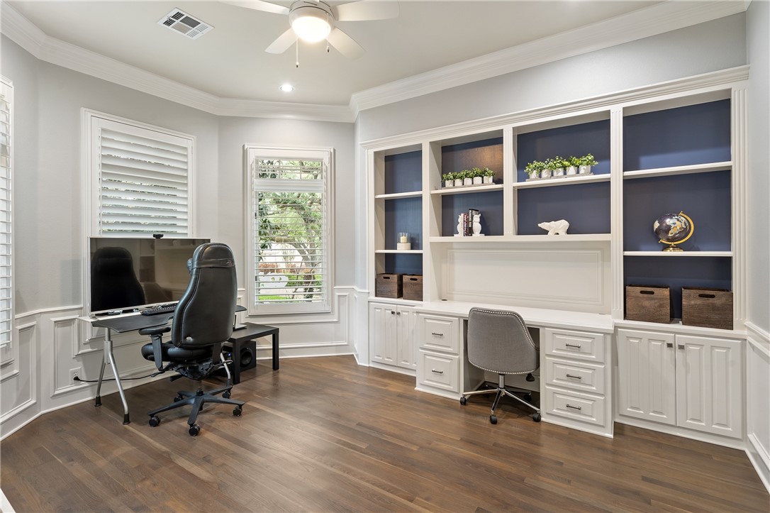 With a built-in desk and shelving, decorative wall molding, and crown molding, the front study offers refined style. - If you have additional questions regarding 2904 MEANDERING RIVER Court  in Austin or would like to tour the property with us call 800-660-1022 and reference MLS# 1563524.