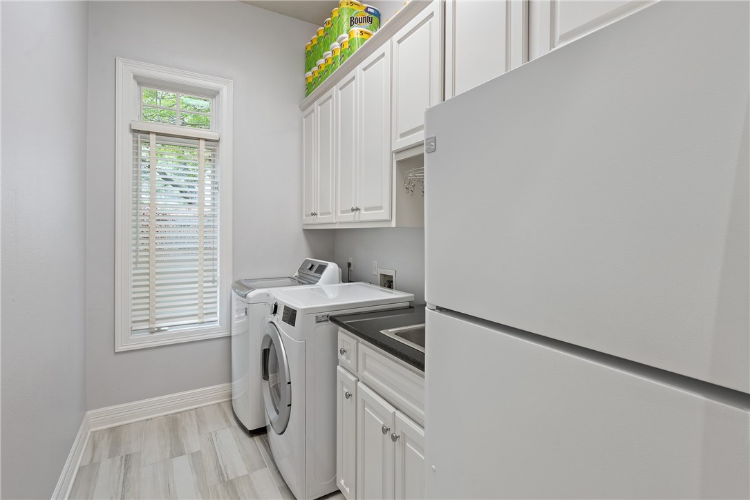 An oversized laundry room is located downstairs across from the butlerΓÇÖs pantry.  Not only is there room for a full-size washer and dryer, the laundry room has space for a second refrigerator and has a full-size sink.  A three-car garage also provides additional storage space and includes built-in cabinets and a workshop table. - If you have additional questions regarding 2904 MEANDERING RIVER Court  in Austin or would like to tour the property with us call 800-660-1022 and reference MLS# 1563524.
