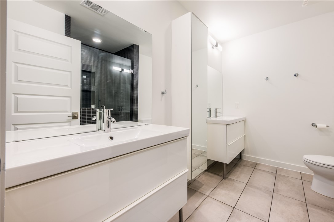 Primary bathroom with 2 separate sinks and storage in between.  Walk-in shower on right. - If you have additional questions regarding 1408 Summit Street  in Austin or would like to tour the property with us call 800-660-1022 and reference MLS# 6576935.