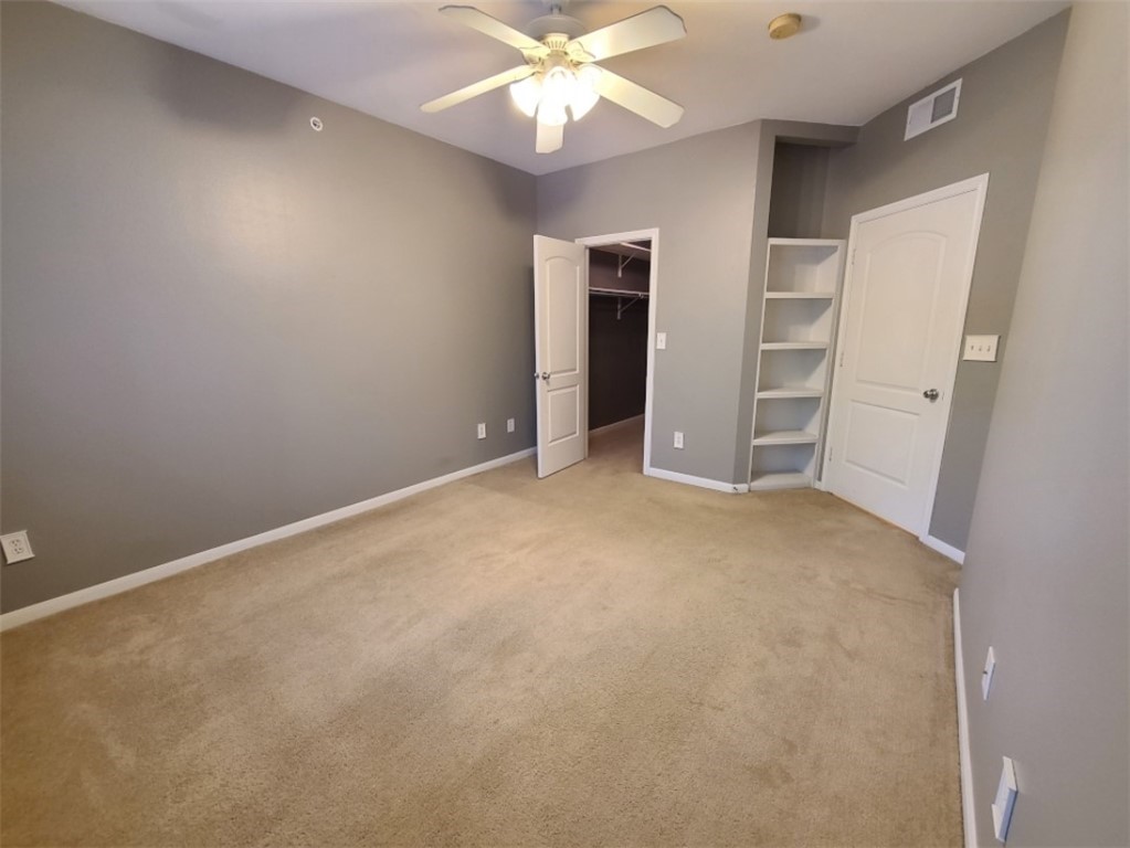 Primary Bedroom with Built-ins and Fan - If you have additional questions regarding 9525 N Capital Of Texas Highway  in Austin or would like to tour the property with us call 800-660-1022 and reference MLS# 9248672.