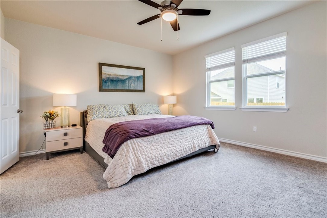 Master bedroom is located downstairs with views out to the backyard! - If you have additional questions regarding 3208 Bratton Crest Lane  in Austin or would like to tour the property with us call 800-660-1022 and reference MLS# 5470643.