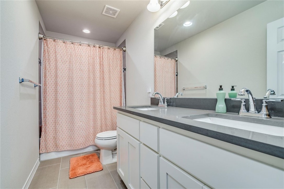 Upstairs bathroom features dual vanities and quartz counters! - If you have additional questions regarding 3208 Bratton Crest Lane  in Austin or would like to tour the property with us call 800-660-1022 and reference MLS# 5470643.