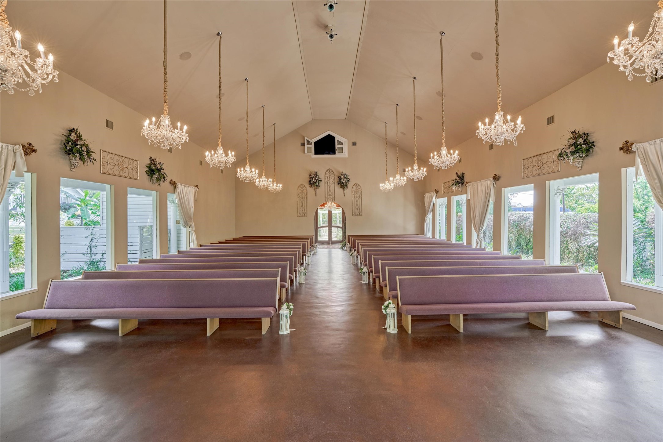 Chapel includes rigged lighting for enhanced photos. Stained concrete floor. Beautiful windows overlooking lush grounds on all three sides. - If you have additional questions regarding 200 E Phillips Street  in Conroe or would like to tour the property with us call 800-660-1022 and reference MLS# 2115847.