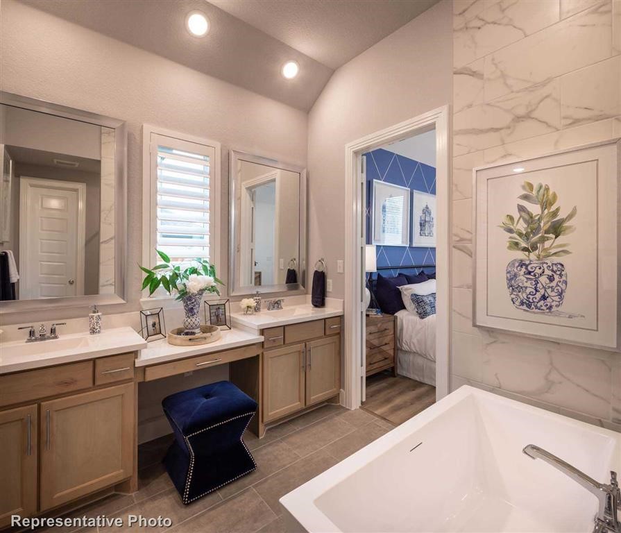 Master Bathroom (Representative Photo) - If you have additional questions regarding 17618 Blushing Meadow Street Street  in Conroe or would like to tour the property with us call 800-660-1022 and reference MLS# 7895006.