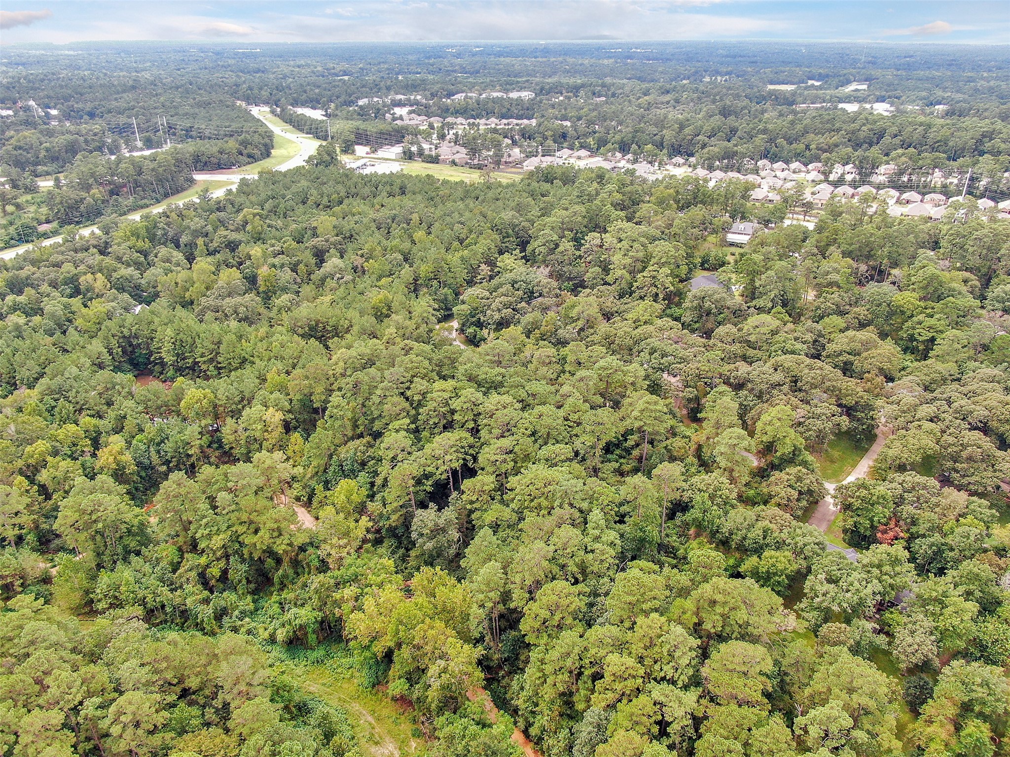 Aerial view - If you have additional questions regarding 4470/4400 Longwood Drive  in Conroe or would like to tour the property with us call 800-660-1022 and reference MLS# 6644823.
